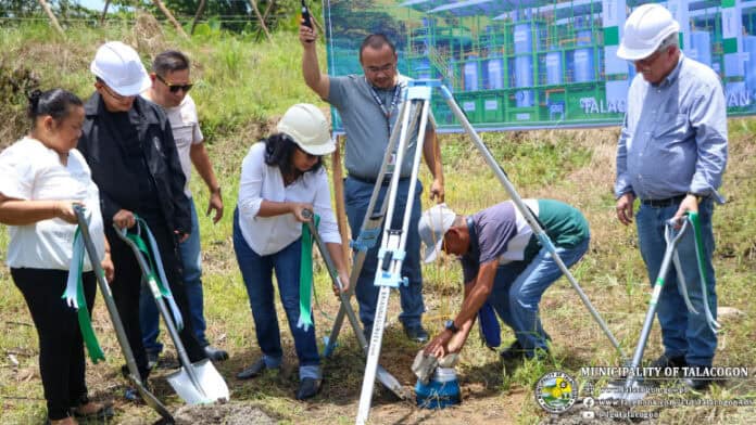 Talacogon Mayor Pauline Marie Masendo leads the burying of the time capsule to mark the launch of the a ₱150-million Biomass Gasification Power Plant. Photo by the Provincial Public Information Office-Agusan del Sur.