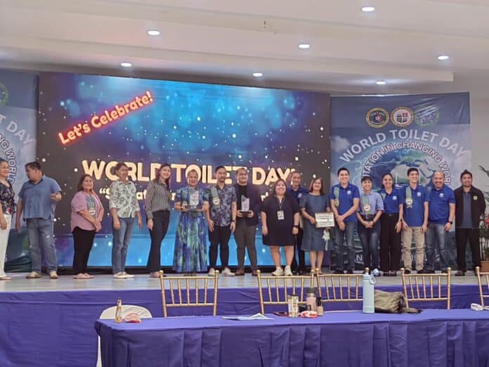 San Francisco Mayor Grace Carmel Paredes-Bravo (holding certificate) receives the Grade I ZOD certification during the World Toilet Day celebration at the Provincial Health Office. Photo courtesy of Municipal Health Office–San Francisco