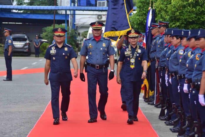 PBGEN Rommel A. Rumbaoa (right) walks alongside PRO13 Regional Director PBGEN Marcial Mariano P. Magistrado IV (center) during a ceremonial event at Police Regional Office 13.