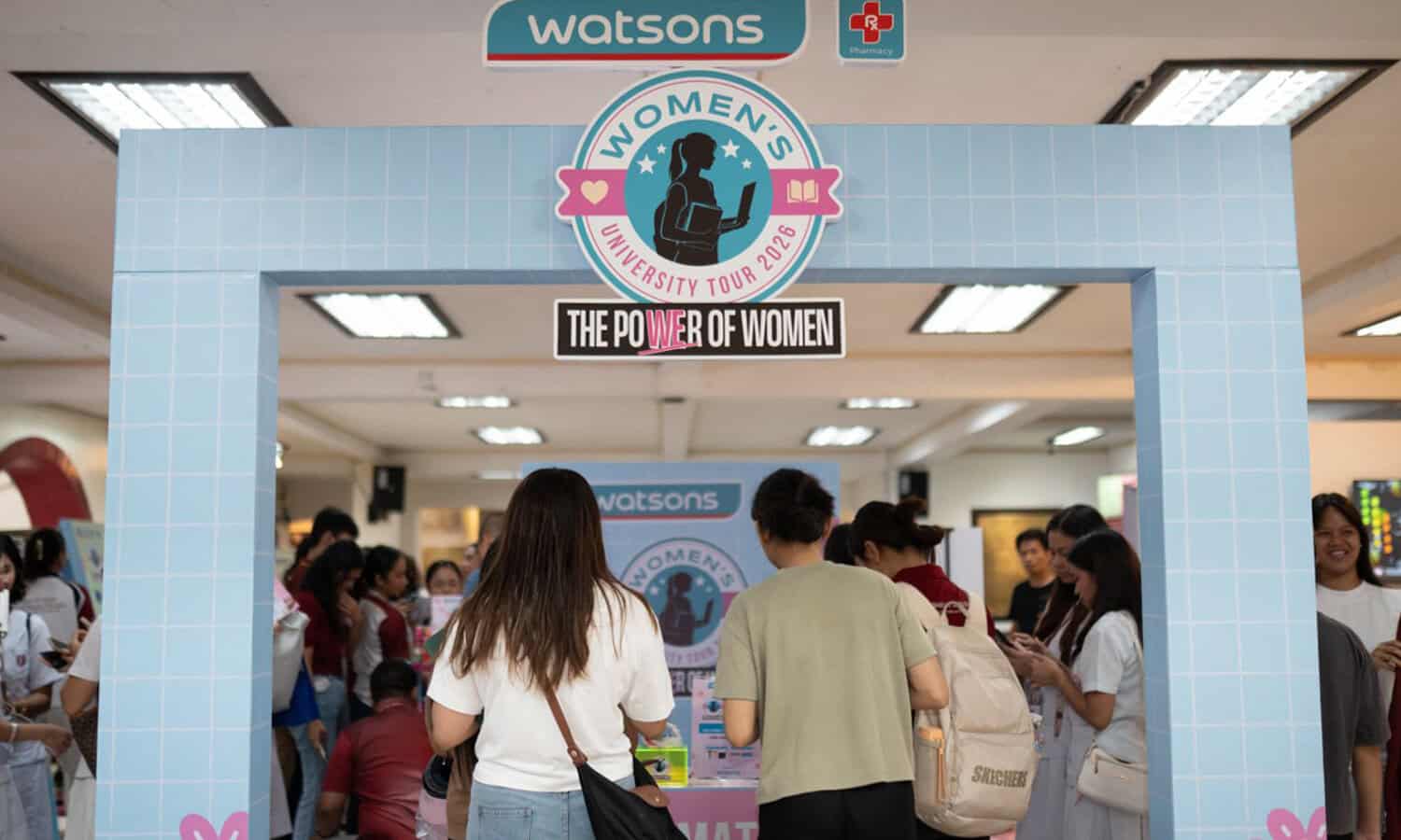 Young women attending Watsons Women's University Tour event in a mall.