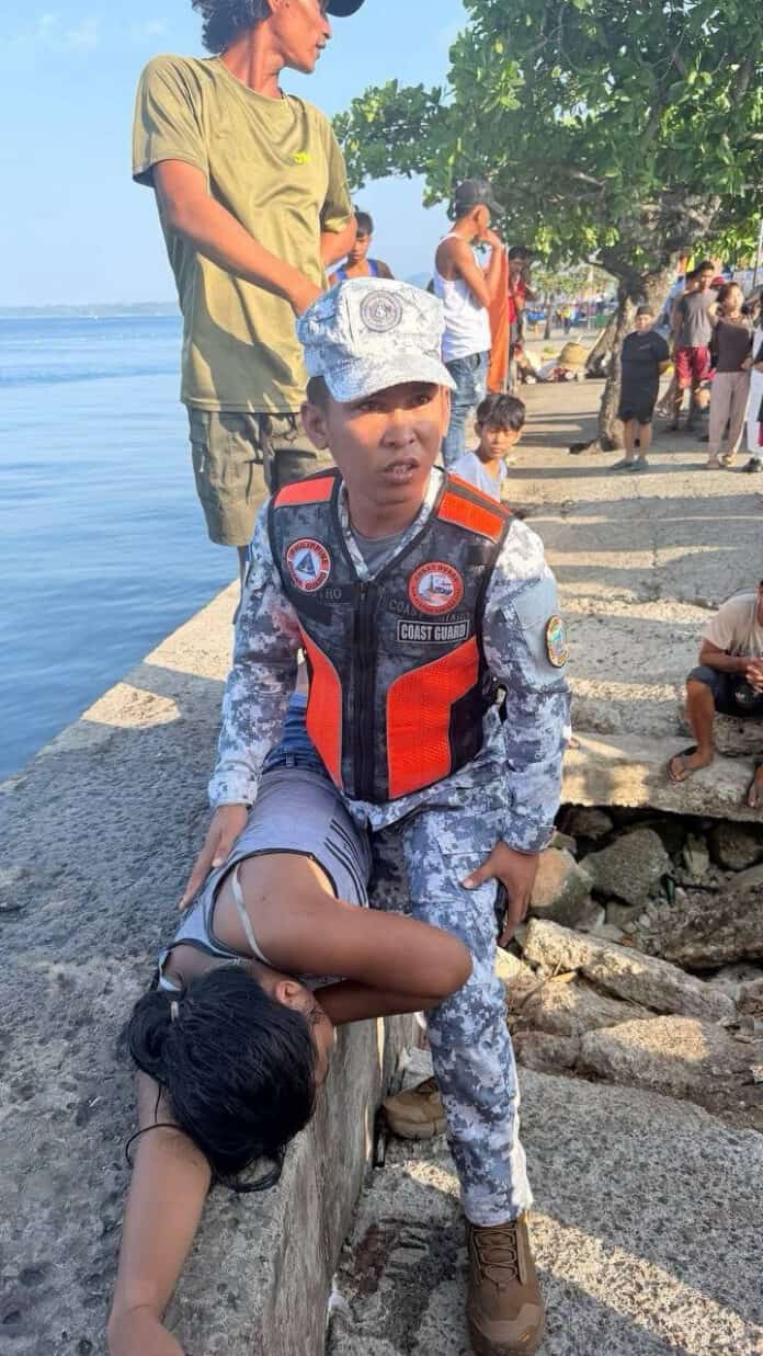 LIFESAVING RESPONSE Philippine Coast Guard Apprentice Seaman Rheyson Maestro assists a 16-year-old girl after she nearly drowned in Barangay Taft, Surigao City, on Sept. 4, 2026. The Coast Guard said Maestro performed cardiopulmonary resuscitation until the teenager regained consciousness. She was later taken to Caraga Regional Hospital in stable condition. (Photo from the Philippine Coast Guard)