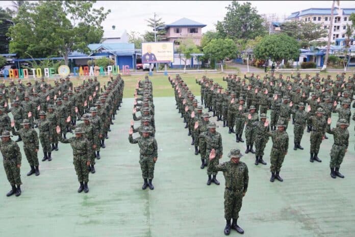 New police recruits take oath. The 202 new recruits of PRO 13 raise their hands during their oath-taking ceremony, marking the start of their service in the Philippine National Police. Photo courtesy of PRO 13