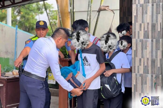 SAFETY CHECK. Personnel conduct a routine bag inspection at the entrance of Agusan del Sur National High School (ASNHS) on Thursday as part of the school’s strengthened security measures to ensure a safe and secure learning environment for students and personnel. 📷 Photo: Agusan del Sur National High School