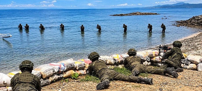 SHORE DEFENSE. Soldiers secure a beachhead during Exercise Surigao Sentinel 01-2026 along the coastal waters of Surigao and the Dinagat Islands. Around 600 military personnel and civilian partners took part in the four-day joint maneuvers aimed at sharpening the Armed Forces of the Philippines’ territorial and archipelagic defense posture along the eastern seaboard. —CONTRIBUTED PHOTO / EASTMINCOM
